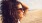 a woman with her hair blowing in the wind